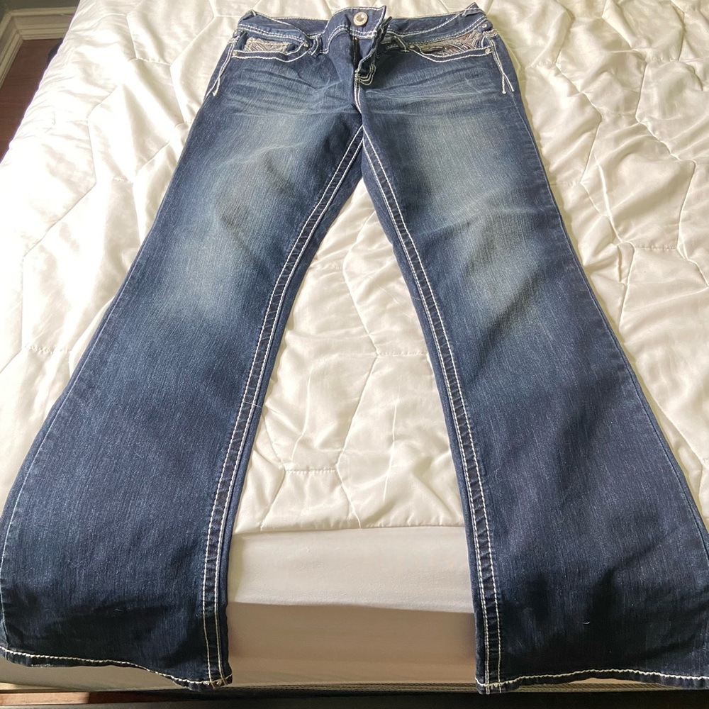 Ladies Maurices brand flare leg jeans, size 9/10, decorative back pockets.